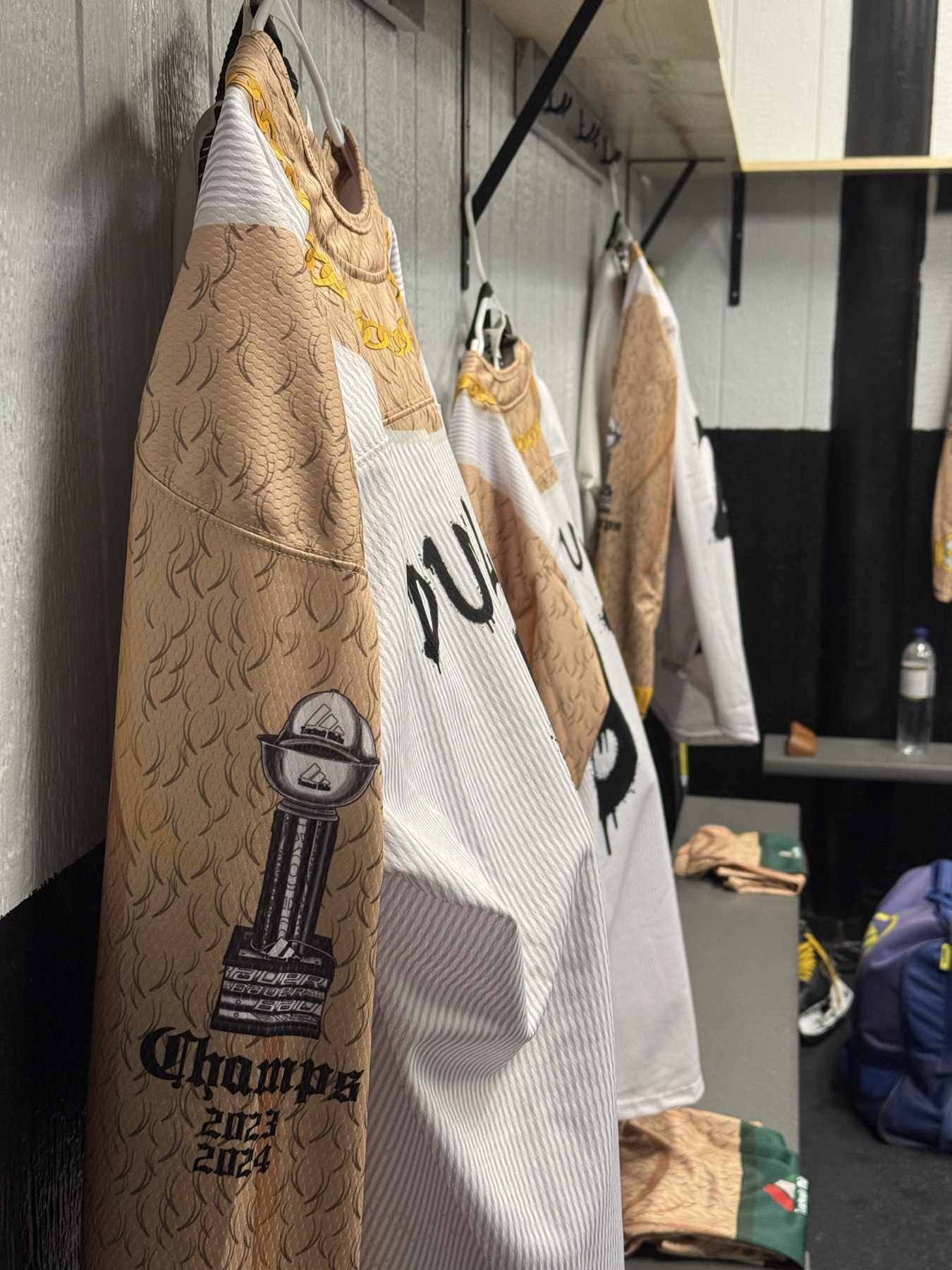 Detailed view of the Track Suit Mafia skins uniform with body hair, jewelry, and championship patch