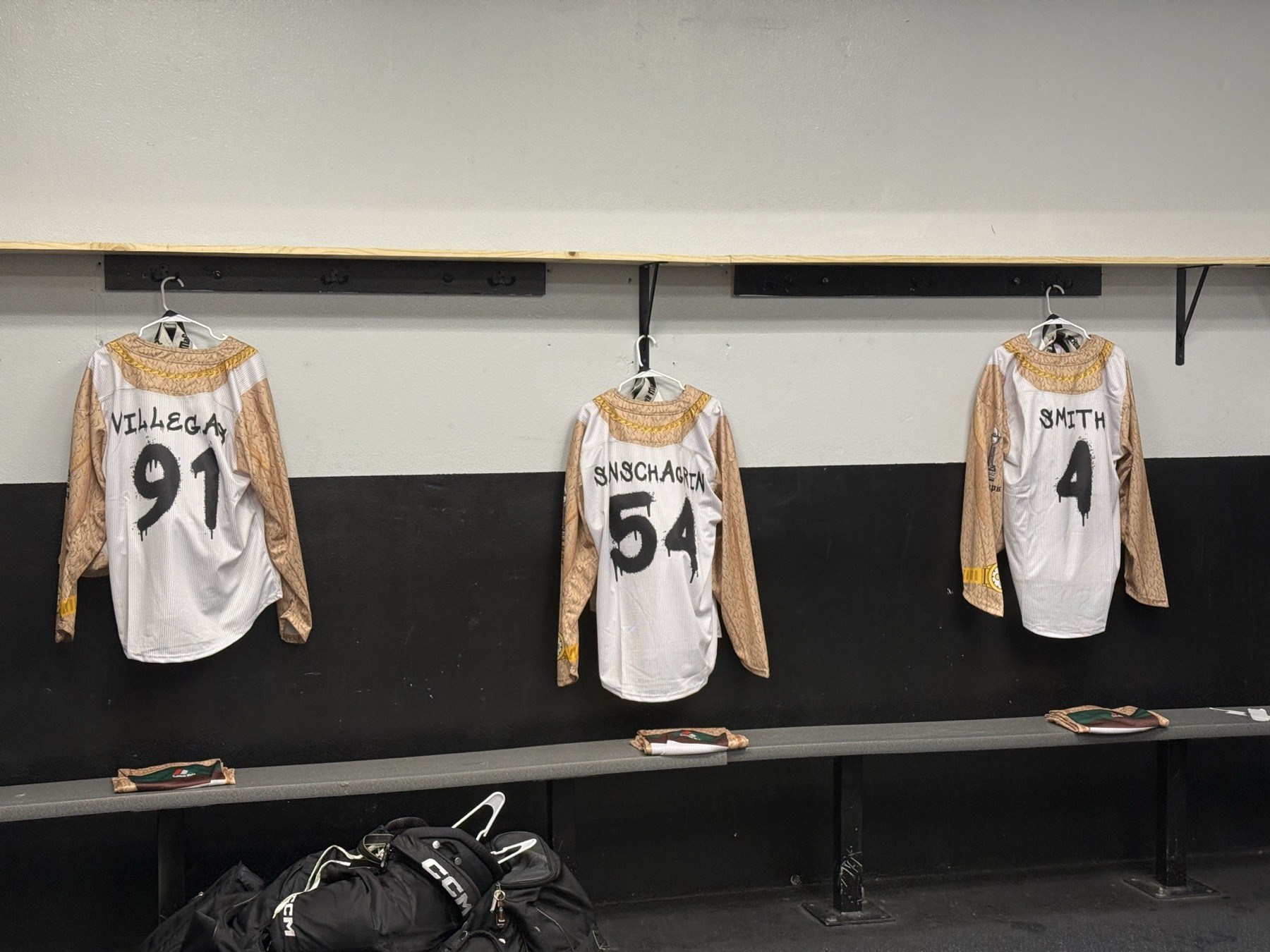 Skins uniforms hanging in the Track Suit Mafia locker room